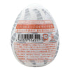 TENGA EGG TORNADO 飛機蛋 背面圖,顯示產品條碼與使用說明,標示螺旋邊緣設計與高彈性材質特點。
