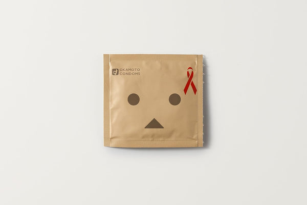岡本 Okamoto 紙箱人 Danboard 特別版安全套 單片 Condom 包裝設計，帶有紅絲帶標誌